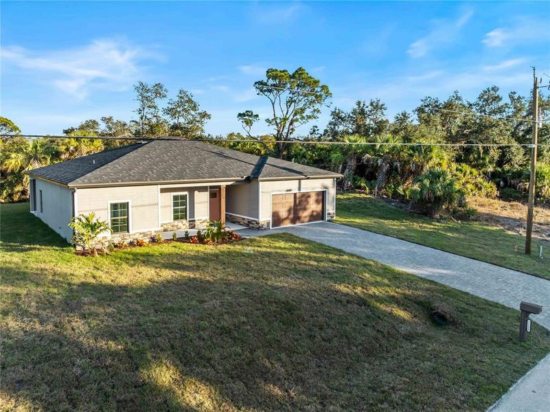 Front exterior of a new home in , North Port, FL, highlighting curb appeal (Image 27).