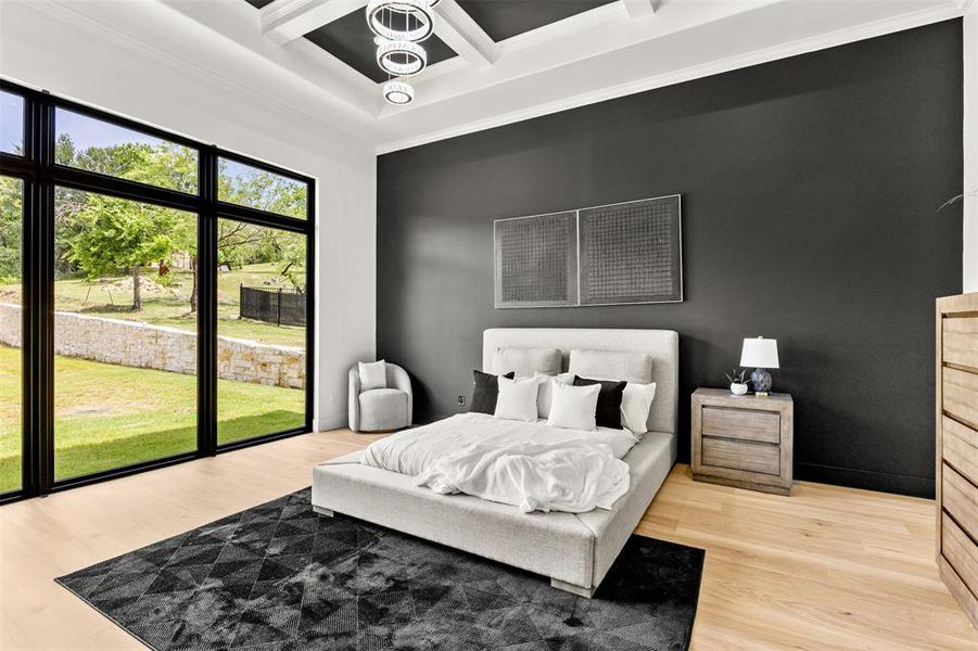 Expansive floor-to-ceiling windows with black frames, wood-finish flooring, a coffered ceiling with a modern light fixture, a contrasting dark accent wall, and perimeter crown molding
