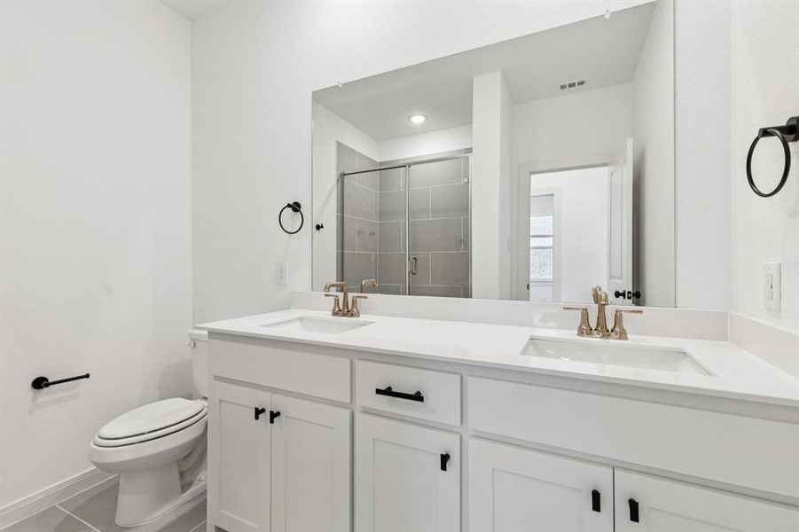 Friends and family will feel right at home in any of the beautifully finished guest baths in our Giselle plan.