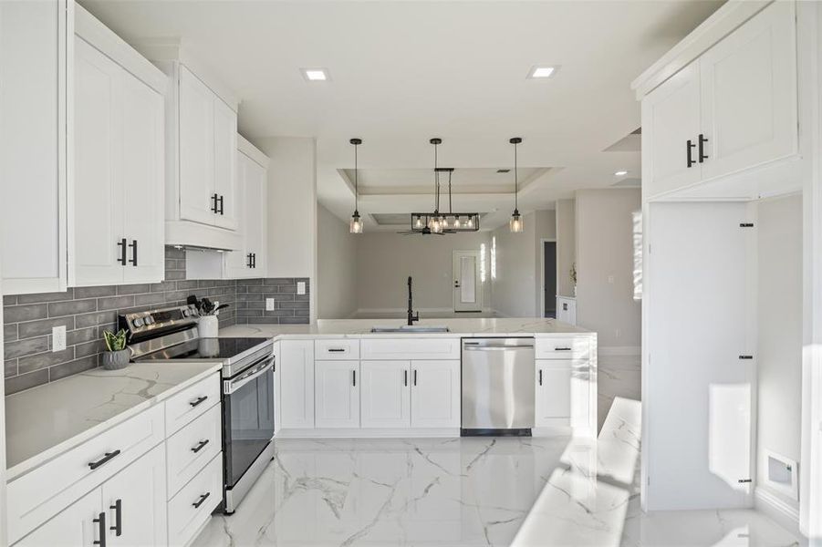 Furnished interior view inside a new home in , Pelican Bay (Image 6).