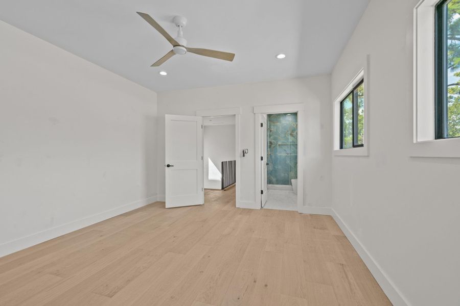 This generously sized bedroom in second floor offers a peaceful retreat with its own attached bathroom. Whether used as a cozy guest quarters , a teenager's haven this upstairs gem delivers both style and functionality with elegant and oversized fans.