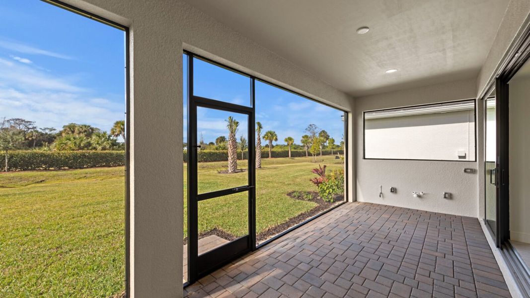 Exterior details and patio area of a home in SkySail, Naples (Image 4).
