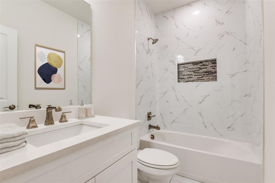Full bathroom with shower / washtub combination and vanity