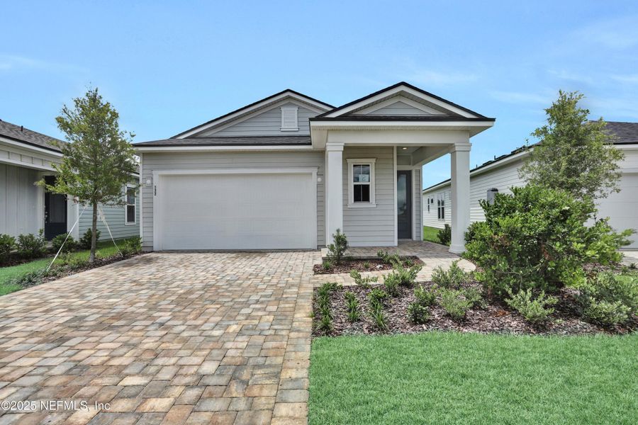 Front exterior of a new home in , St. Augustine, FL, highlighting curb appeal (Image 1).