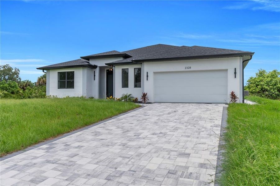Front exterior of a new home in , North Port, FL, highlighting curb appeal (Image 20).