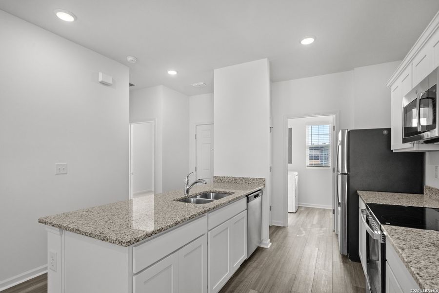 Furnished interior view inside a new home in Sutton Farms, San Antonio (Image 6).