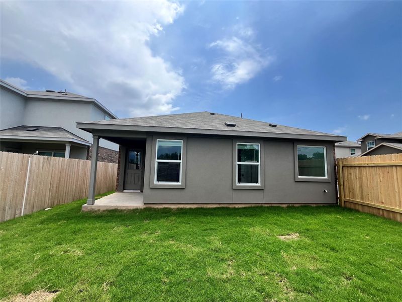 Front exterior of a new home in Woodfield Preserve: Ridgepointe Collection, Georgetown, TX, highlighting curb appeal (Image 9).