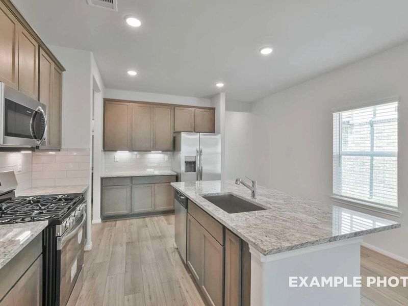 Furnished interior view inside a new home in Caney Creek Place, Conroe (Image 7).