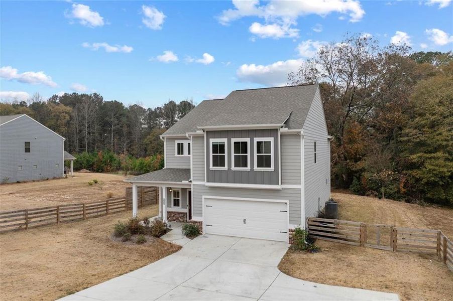 Front exterior of a new home in , Auburn, GA, highlighting curb appeal (Image 25).