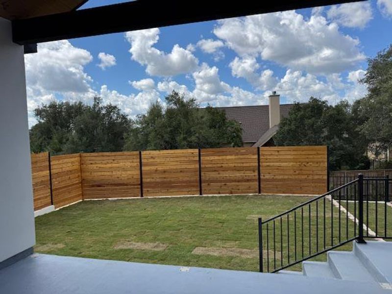View of patio and back courtyard from Livingroom View of patio and back courtyard from Livingroom
