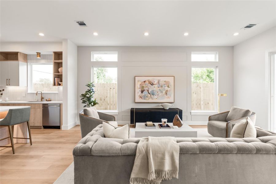 High ceilings and an accent wall, makes this space feel so rich and elevated. It's easy to picture everyday life filling this room