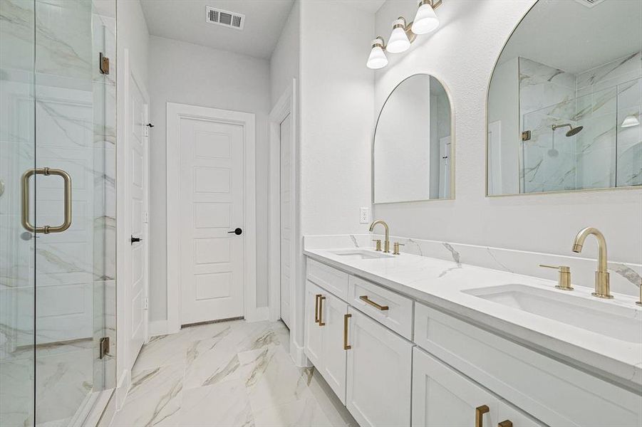 Bathroom with vanity and an enclosed shower