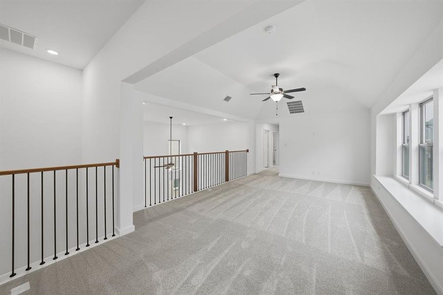 Carpeted spare room with ceiling fan and recessed lighting