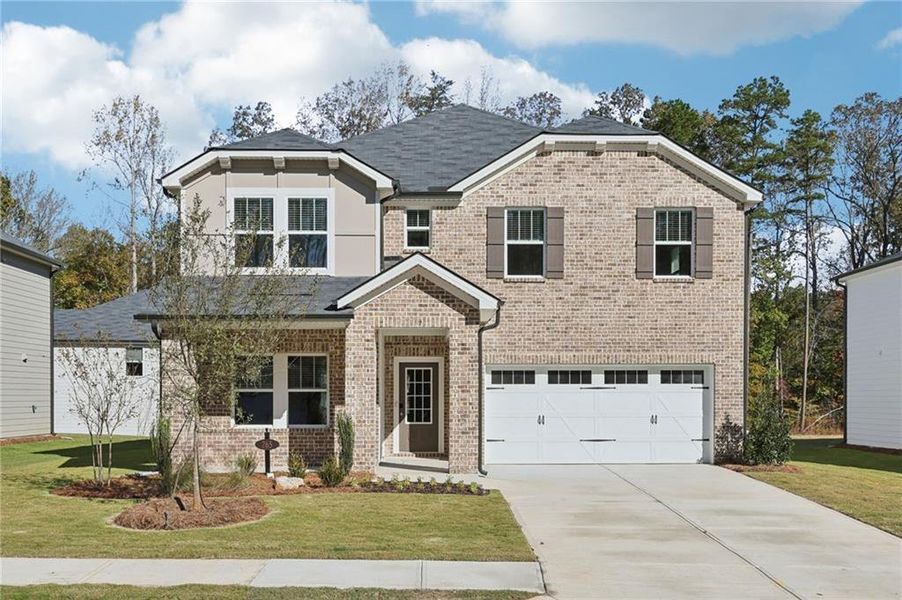 Front exterior of a new home in The Oaks at Dawson, Dawsonville, GA, highlighting curb appeal (Image 1). Front exterior of a new home in The Oaks at Dawson, Dawsonville, GA, highlighting curb appeal (Image 1).