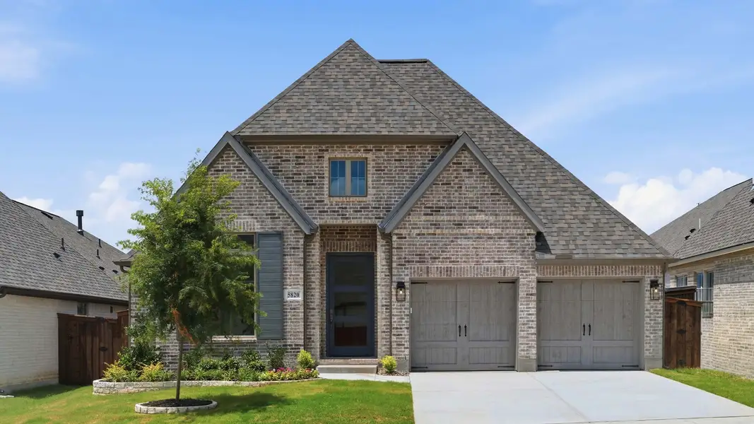 Front exterior of a new home in Ventana, Fort Worth, TX, highlighting curb appeal (Image 1). Front exterior of a new home in Ventana, Fort Worth, TX, highlighting curb appeal (Image 1).