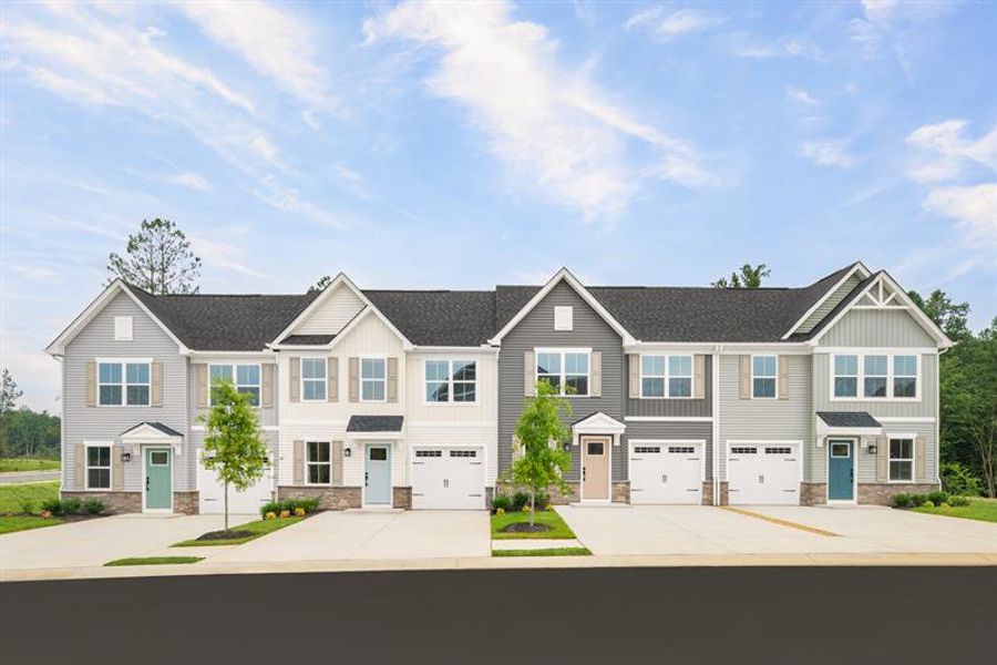 Representative exterior photo of a completed home built from the Nassau Cove Essential by Ryan Homes in Lakes at Riverbend, Navassa, NC (Image 1). Representative exterior photo of a completed home built from the Nassau Cove Essential by Ryan Homes in Lakes at Riverbend, Navassa, NC (Image 1).