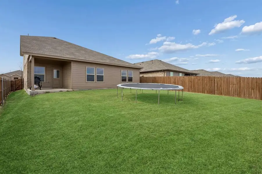 Exterior details and patio area of a home in River's Edge, Fort Worth (Image 4).