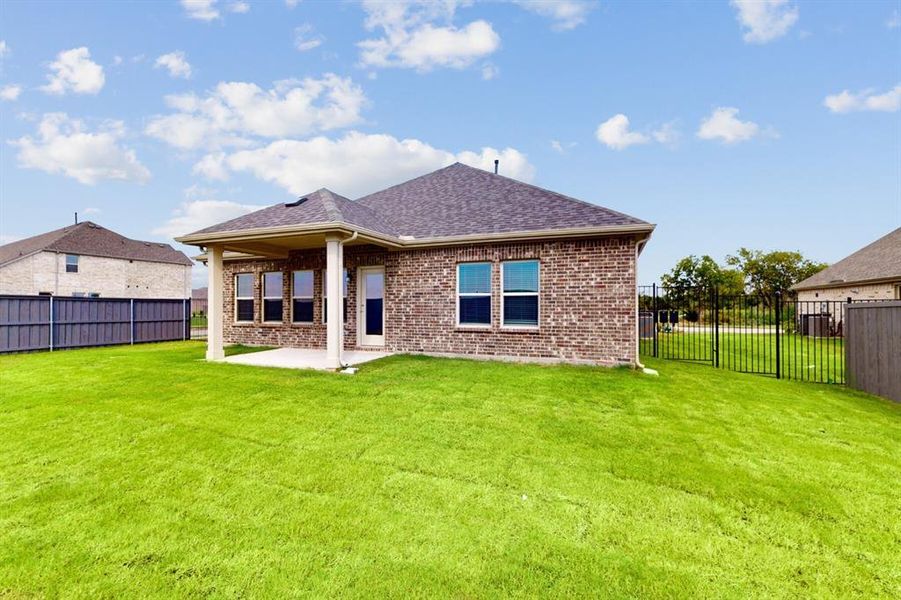 Exterior details and patio area of a home in Prairie Ridge at Goodland, Venus (Image 23).