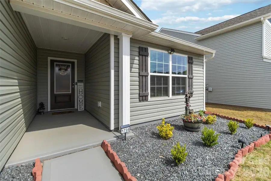 Exterior details and patio area of a home in McKee Creek Village, Charlotte (Image 3).