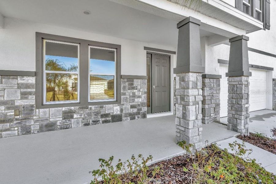 Exterior details and patio area of a home in Mangrove Manor, Apollo Beach (Image 23).