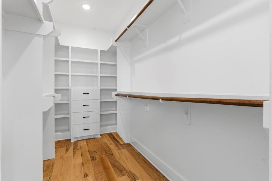 Expansive walk-in closet in the primary suite—plenty of room for organization, storage, and style.