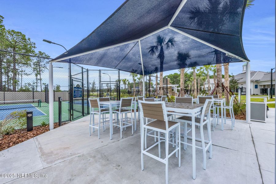 Front exterior of a new home in Summer Bay at Grand Oaks, St. Augustine, FL, highlighting curb appeal (Image 18).