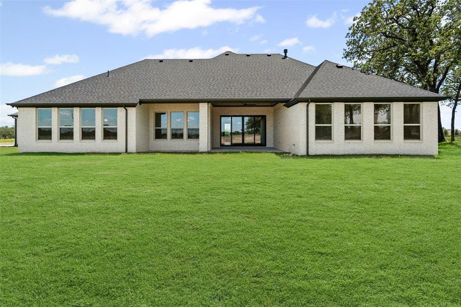 Front exterior of a new home in Santana Ridge, Weatherford, TX, highlighting curb appeal (Image 1). Front exterior of a new home in Santana Ridge, Weatherford, TX, highlighting curb appeal (Image 1).