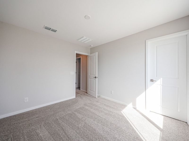 A hallway with white doors. A hallway with white doors.