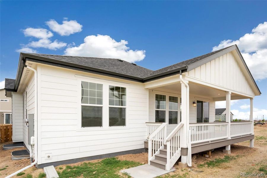 Front exterior of a new home in Turnberry, Commerce City, CO, highlighting curb appeal (Image 21).
