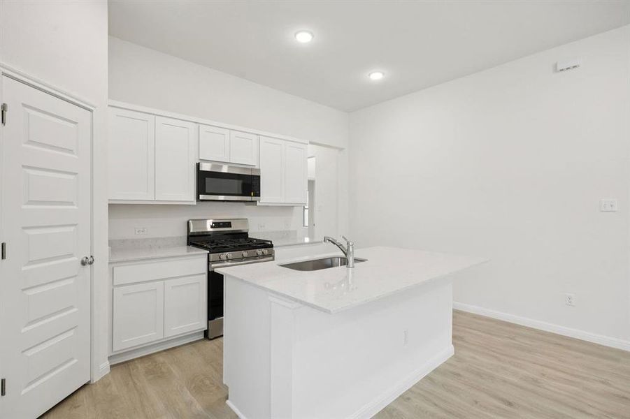 Kitchen in the Cypress home plan by Trophy Signature Homes - REPRESENTATIVE PHOTO