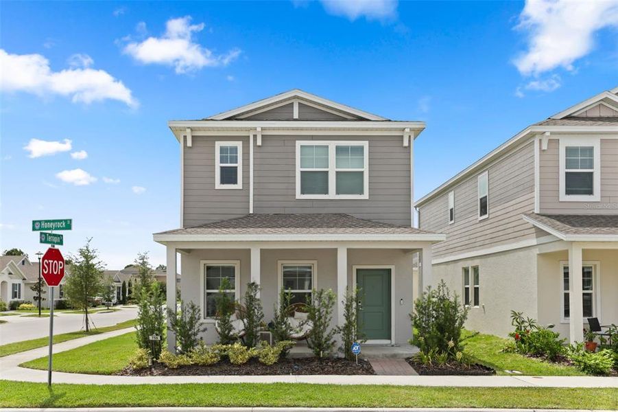 Front exterior of a new home in Rivington, Debary, FL, highlighting curb appeal (Image 2).
