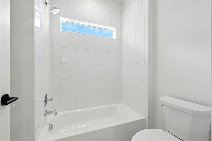 Bathroom featuring shower / washtub combination Bathroom featuring shower / washtub combination