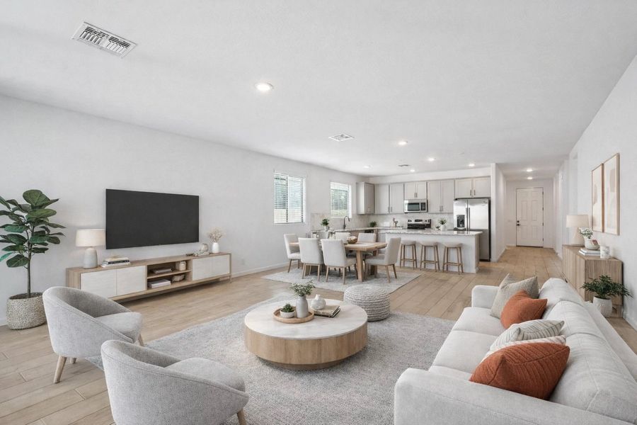 Great room and kitchen. Virtually staged. Not actual home, finishes may vary by community. Great room and kitchen. Virtually staged. Not actual home, finishes may vary by community.
