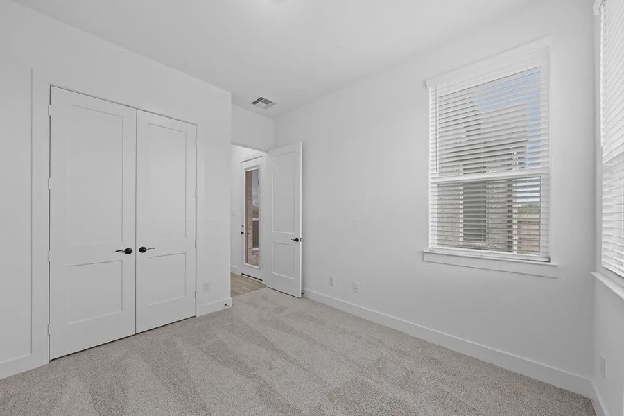 Representative unfurnished interior of a home built from the Summerton by Chesmar Homes in University Heights, Round Rock (Image 27).
