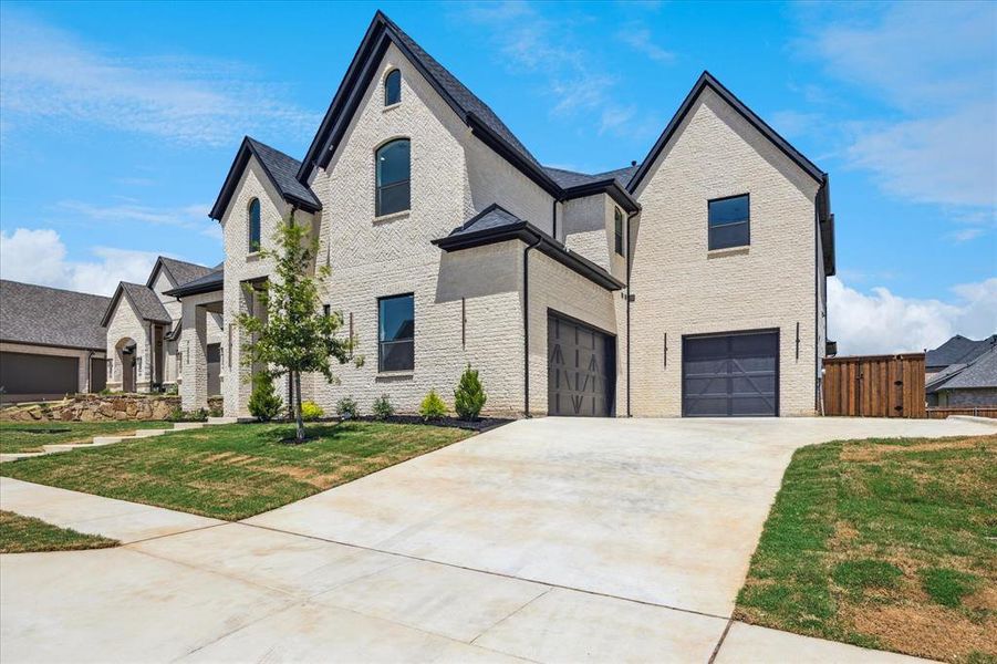Front exterior of a new home in , North Richland Hills, TX, highlighting curb appeal (Image 1). Front exterior of a new home in , North Richland Hills, TX, highlighting curb appeal (Image 1).