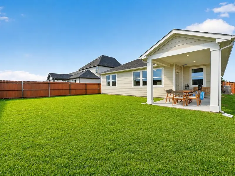 Exterior details and patio area of a home in Heartland, Crandall (Image 3). Exterior details and patio area of a home in Heartland, Crandall (Image 3).