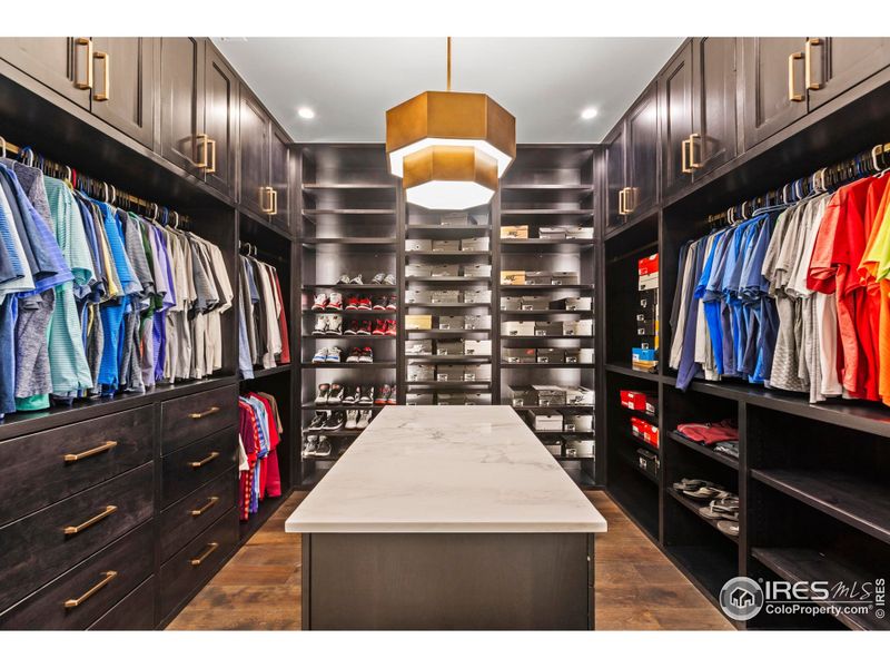 One of two primary walk in closets