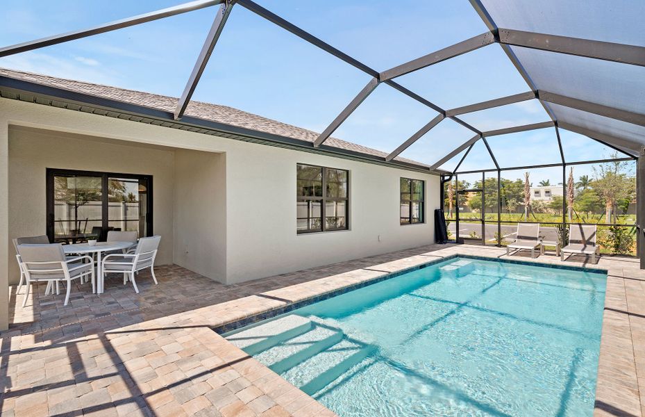 Exterior details and patio area of a home in Whispering Lakes, Lehigh Acres (Image 24).