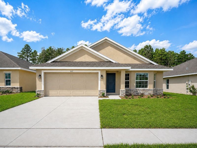 Front exterior of a new home in Arbor Park, Leesburg, FL, highlighting curb appeal (Image 1). Front exterior of a new home in Arbor Park, Leesburg, FL, highlighting curb appeal (Image 1).