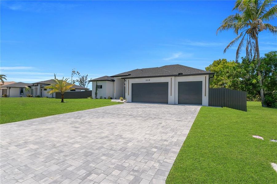 Front exterior of a new home in , Cape Coral, FL, highlighting curb appeal (Image 27).