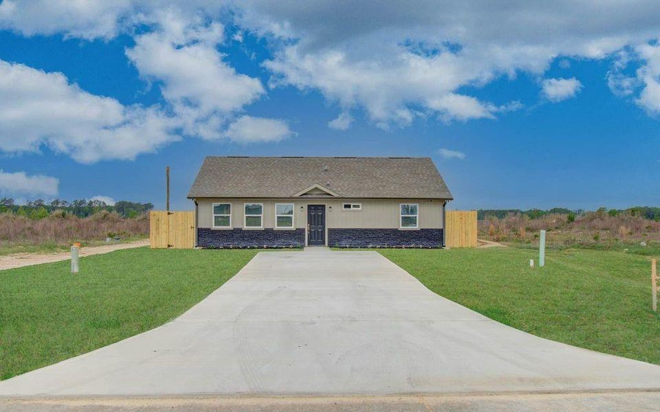 A charming home beneath a beautiful Texas blue sky. No side or back neighbors.