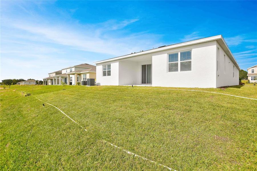 Exterior details and patio area of a home in Seasons at Bella Vista, Dundee (Image 3).