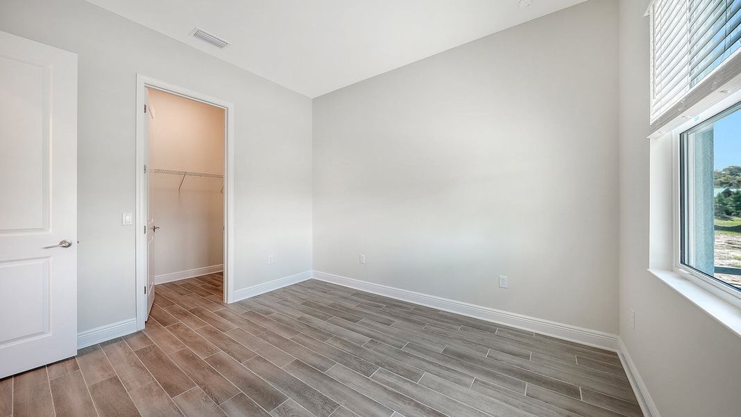 Spacious, unfurnished interior of a new home in Canoe Creek Real Estate and Homes for Sale in Parrish, FL - Neal Communities, Parrish (Image 62).