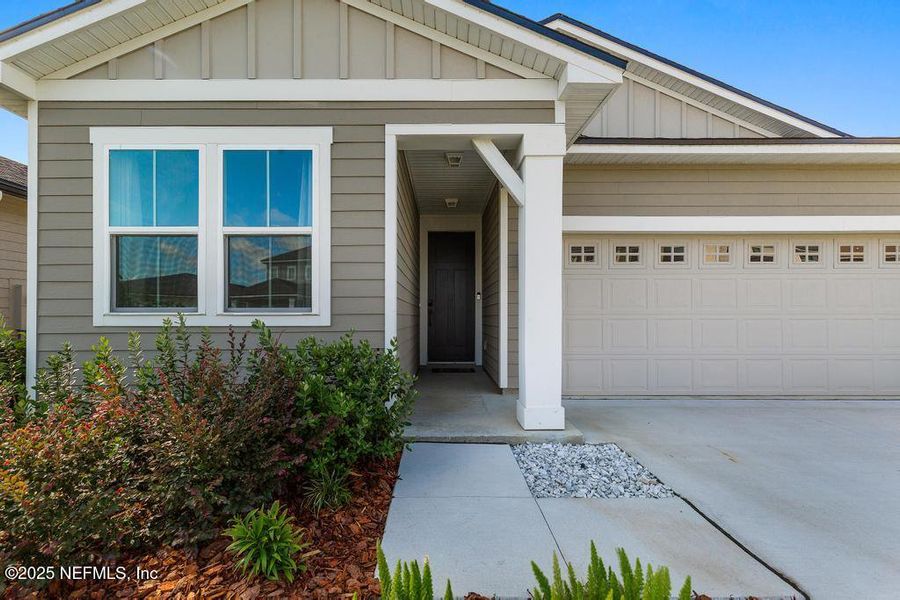 Front exterior of a new home in , Yulee, FL, highlighting curb appeal (Image 1). Front exterior of a new home in , Yulee, FL, highlighting curb appeal (Image 1).