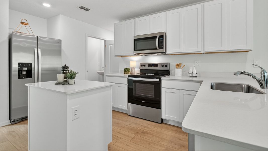 Representative furnished interior of a home built from the Carson by D.R. Horton in Trout River, Jacksonville (Image 5).