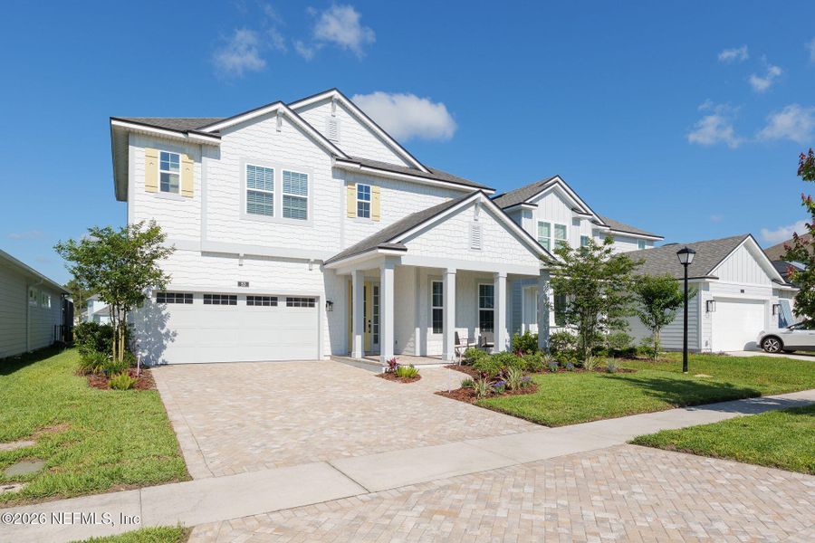 Front exterior of a new home in Seabrook Village at Seabrook, Ponte Vedra, FL, highlighting curb appeal (Image 32).