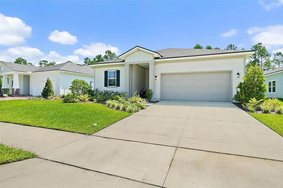 Front exterior of a new home in , Palm Coast, FL, highlighting curb appeal (Image 2). Front exterior of a new home in , Palm Coast, FL, highlighting curb appeal (Image 2).