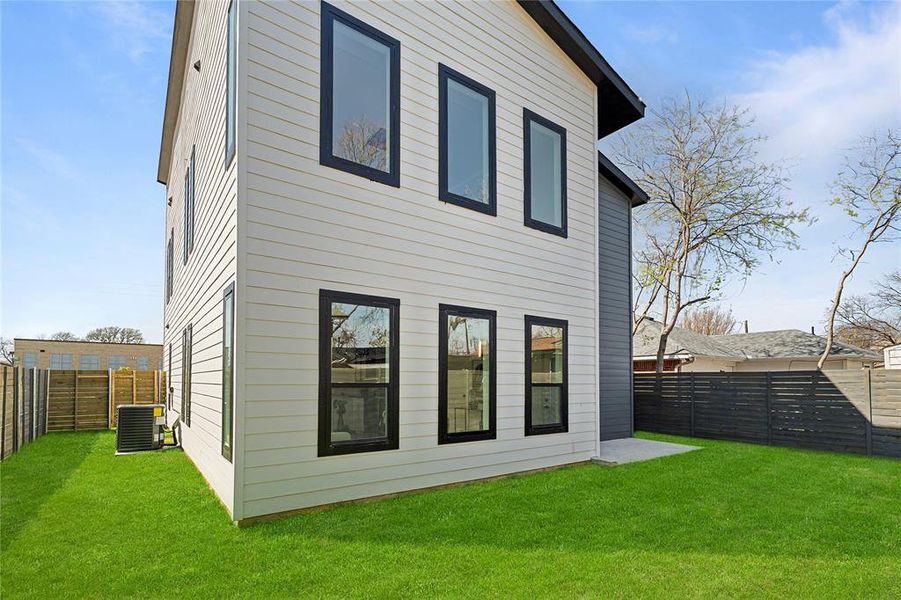 Back of property featuring a fenced backyard