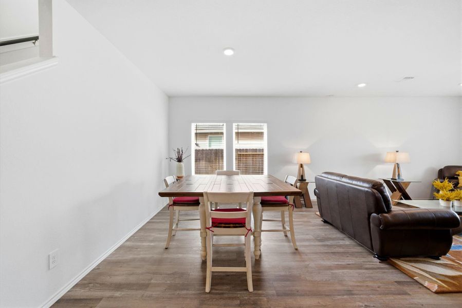 Formal-to-casual versatility: a large dining room with direct sightlines and easy access to the kitchen and living room.