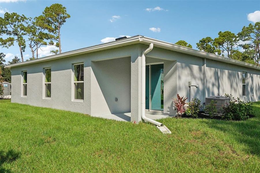 Exterior details and patio area of a home in North Port Classic, North Port (Image 29).